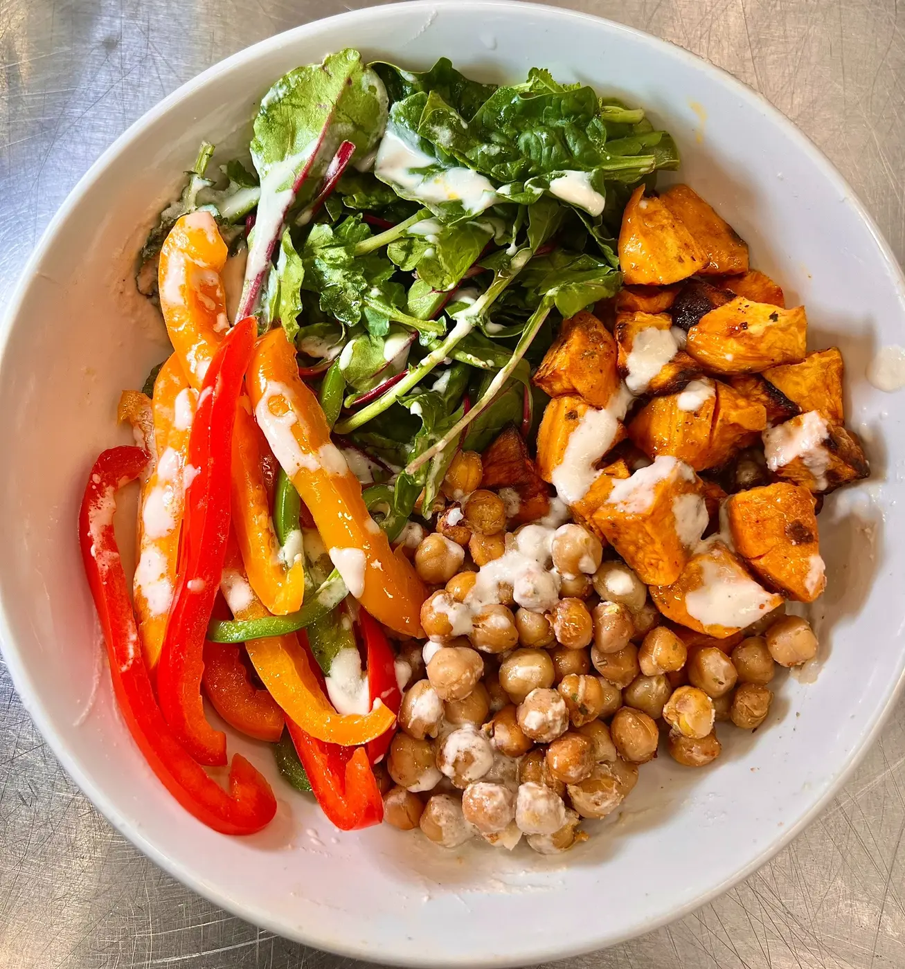 Caribbean Glow Bowl with sweet potato, chickpeas, greens, and cashew cream