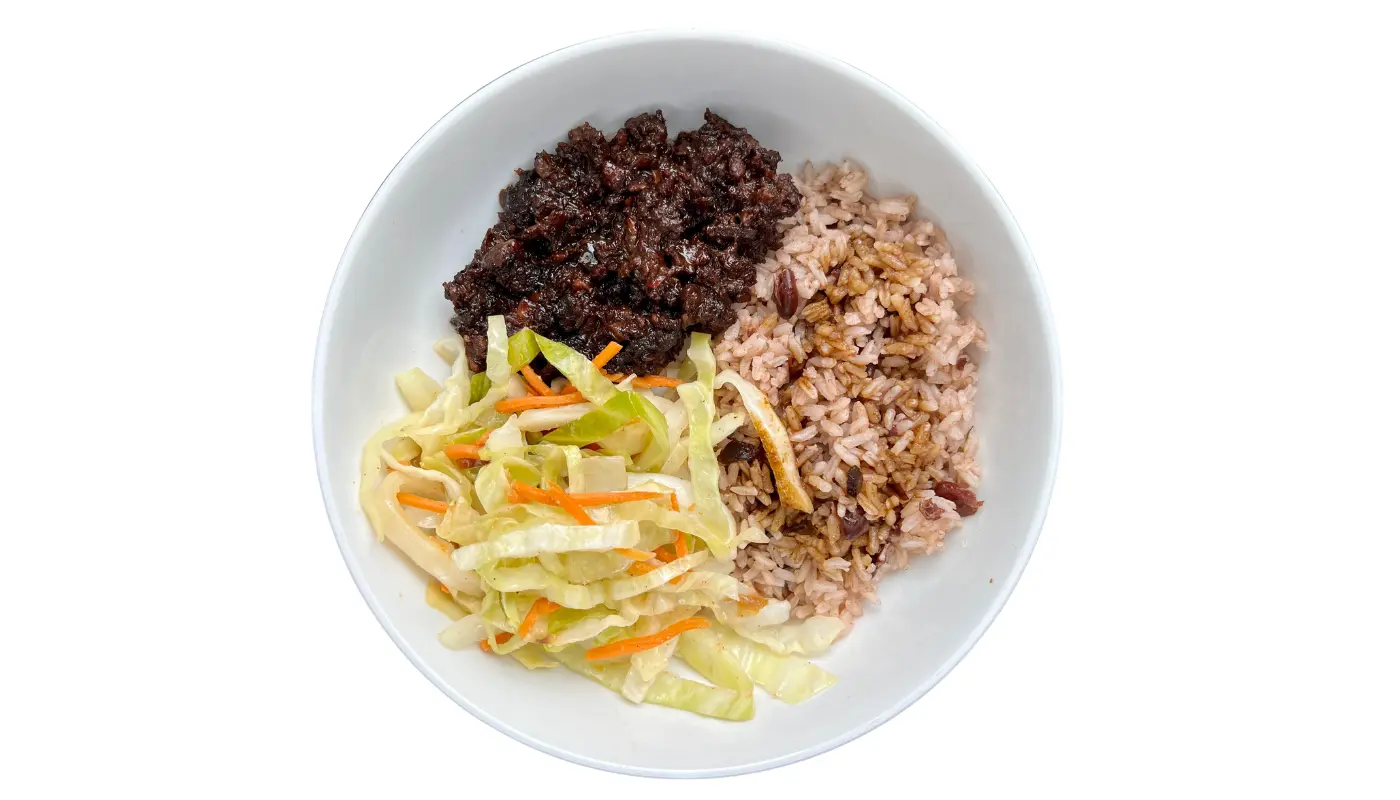 Vegan oxtail bowl with rice and peas, cabbage, and plantains
